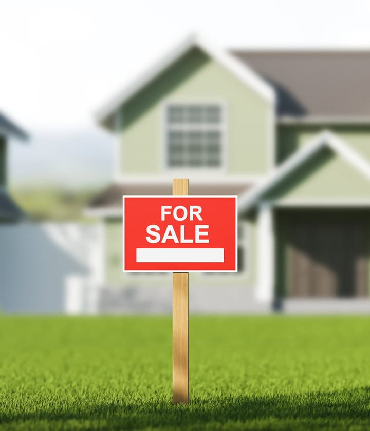 For sale sign in front of a home representing homeowner resources for buying and selling property