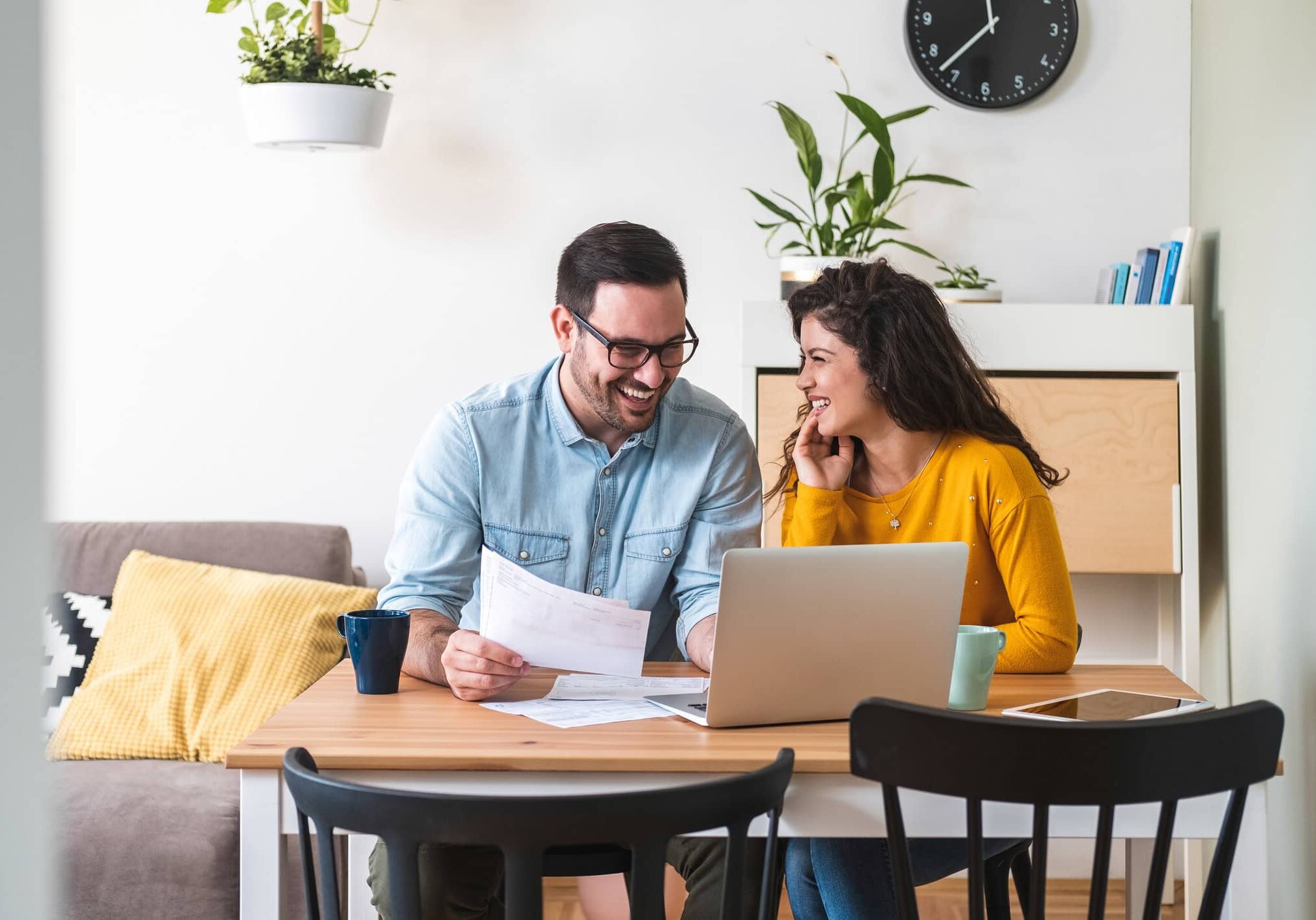 Homeowner resources with homeowners reviewing maintenance documents and service requests
